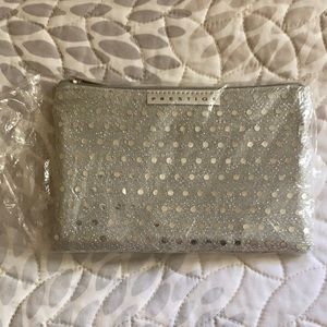 New Silver wallet or change purse in bag.